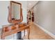 Inviting hallway with tile floors and a wooden foyer table at 1788 Palm View Rd, Sarasota, FL 34240