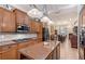 Bright kitchen with granite countertops, stainless appliances, and a view to the dining area at 1788 Palm View Rd, Sarasota, FL 34240