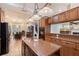 Gourmet kitchen boasts stainless steel appliances, custom cabinets, and a central island for cooking at 1788 Palm View Rd, Sarasota, FL 34240