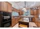 Well-equipped kitchen featuring granite countertops, stainless appliances, and custom cabinetry for storage at 1788 Palm View Rd, Sarasota, FL 34240