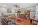 Spacious living room with hardwood floors and bookshelves at 1788 Palm View Rd, Sarasota, FL 34240