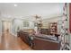 Spacious living room with hardwood floors, bookcases, sofas, and natural light, creating a cozy atmosphere at 1788 Palm View Rd, Sarasota, FL 34240