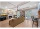Comfortable living room featuring a stone fireplace and French doors at 1788 Palm View Rd, Sarasota, FL 34240