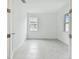 Bright bedroom with tiled floor, white walls, and natural light from two windows at 18016 Cherished Loop, Bradenton, FL 34211