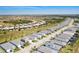 Aerial view showcases the home's location within a vibrant community and its proximity to amenities at 18525 Midsummer Pl, Venice, FL 34293