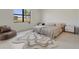 Serene bedroom with a minimalist design, large window and plenty of natural light at 18525 Midsummer Pl, Venice, FL 34293