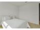 Comfortable bedroom featuring a neutral color scheme and carpeted floors at 18525 Midsummer Pl, Venice, FL 34293