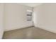 Bright bedroom showcasing clean walls and tiled floors at 18525 Midsummer Pl, Venice, FL 34293