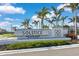 Welcoming Solstice Wellen Park community entrance sign with lush landscaping and bright blue skies at 18525 Midsummer Pl, Venice, FL 34293