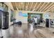 Well-equipped gym featuring modern machines, TVs, and a punching bag for a complete workout at 18525 Midsummer Pl, Venice, FL 34293