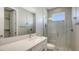 Bathroom with vanity with modern fixtures and glass shower at 1907 Woodleaf Hammock Ct, Bradenton, FL 34211
