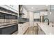 Modern kitchen with stainless steel appliances, tile backsplash, and built-in oven and microwave at 1907 Woodleaf Hammock Ct, Bradenton, FL 34211