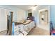 Cozy bedroom featuring blue walls, and comfortable furniture and decor at 209 29Th Nw St, Bradenton, FL 34205
