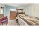 The bedroom has natural light, hardwood floors, and neutral-colored walls at 209 29Th Nw St, Bradenton, FL 34205