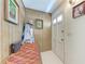 Cozy entryway featuring wood paneling and ample space for storage and decor at 209 29Th Nw St, Bradenton, FL 34205
