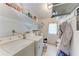Functional laundry room with washer, dryer, and ample storage space at 209 29Th Nw St, Bradenton, FL 34205