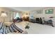 Spacious living room with large windows providing natural light and views of the backyard at 209 29Th Nw St, Bradenton, FL 34205