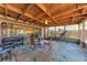 View of the screened outdoor patio with workout equipment and a table with chairs at 209 29Th Nw St, Bradenton, FL 34205