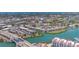 Aerial view of Bella Costa condos, the surrounding area, and a bridge nearby the waterfront complex at 210 Santa Maria St # 244, Venice, FL 34285
