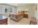 Comfortable bedroom with a window view and stylish furnishings at 210 Santa Maria St # 244, Venice, FL 34285