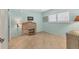 A well-lit bedroom with bright walls, tile floors and wicker furniture at 210 Santa Maria St # 244, Venice, FL 34285