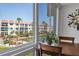 Bright condo dining area with view of waterfront community, docks, and boats at 210 Santa Maria St # 244, Venice, FL 34285