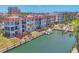Waterfront condo featuring a boat slip, with stairs from the decks leading to the boat dock at 210 Santa Maria St # 244, Venice, FL 34285