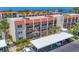 Exterior view of the condo complex, highlighting the covered parking and garden areas at 210 Santa Maria St # 244, Venice, FL 34285