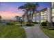 Condo building with landscaped grounds and a walkway leading to the entrance at 210 Santa Maria St # 244, Venice, FL 34285