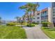 Well-maintained condo building surrounded by lush tropical landscaping and a scenic waterfront at 210 Santa Maria St # 244, Venice, FL 34285