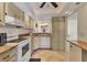 Well-lit kitchen with granite countertops and ample cabinet space at 210 Santa Maria St # 244, Venice, FL 34285