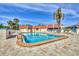 Refreshing pool invites you for a swim with lounge chairs and umbrellas offering a relaxing retreat at 210 Santa Maria St # 244, Venice, FL 34285