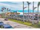 Scenic street view featuring palm trees lining the road and well-maintained landscaping, enhancing curb appeal at 210 Santa Maria St # 244, Venice, FL 34285