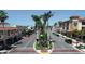 Charming street view showcasing the building with beautiful trees and landscaping at 210 Santa Maria St # 244, Venice, FL 34285