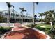 Attractive street view of a shopping center with mature palm trees and landscaping at 210 Santa Maria St # 244, Venice, FL 34285