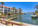 Picturesque waterfront view showcasing boats docked along the canal in this waterfront community at 210 Santa Maria St # 244, Venice, FL 34285