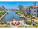 Beautiful waterfront view featuring a patio with a fire pit and access to a private boat dock at 210 Santa Maria St # 244, Venice, FL 34285
