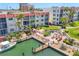 Scenic aerial view of waterfront condos and a private boat dock with access to the water at 210 Santa Maria St # 244, Venice, FL 34285