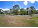 Spacious fenced-in backyard under a clear sky with lots of privacy at 21616 67Th E Ave, Bradenton, FL 34211