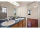 Bathroom featuring a dual sink vanity with natural light at 21616 67Th E Ave, Bradenton, FL 34211