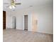 A bathroom leading into a bedroom shows a shower and bathtub at 21616 67Th E Ave, Bradenton, FL 34211