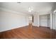 Spacious bedroom featuring wood floors, closet and adjacent stairway view at 21616 67Th E Ave, Bradenton, FL 34211