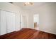 Bedroom with hardwood floors, ceiling fan, and large closet at 21616 67Th E Ave, Bradenton, FL 34211
