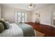 Bedroom featuring hardwood floors and french doors opening to the outdoor living space at 21616 67Th E Ave, Bradenton, FL 34211