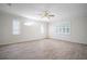 Large bedroom featuring hardwood floors, large windows, and plenty of natural light at 21616 67Th E Ave, Bradenton, FL 34211
