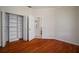 Neat bedroom with wood floors, closet, and neutral color scheme at 21616 67Th E Ave, Bradenton, FL 34211