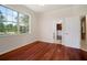 Bedroom featuring hardwood floors and an entry to a closet at 21616 67Th E Ave, Bradenton, FL 34211