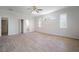 Large bedroom featuring hardwood floors, large windows, and access to an attached bathroom at 21616 67Th E Ave, Bradenton, FL 34211