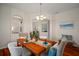 Bright dining room with hardwood floors and arched doorways to other living spaces at 21616 67Th E Ave, Bradenton, FL 34211