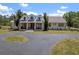 Beautiful home featuring a covered front porch with stylish columns and a curved asphalt driveway at 21616 67Th E Ave, Bradenton, FL 34211